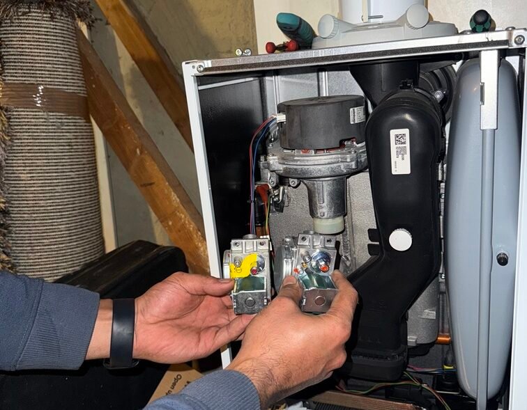 BeFix Gas Safe engineer replacing a faulty gas valve on a wall-mounted boiler